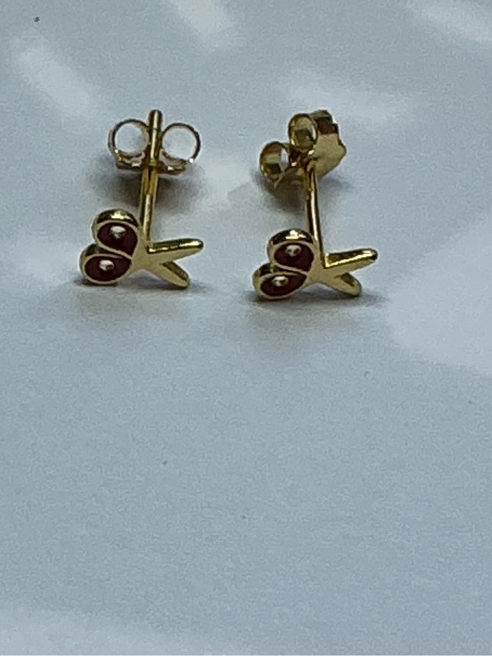 Sterling Silver gold tone scissors stud earrings.